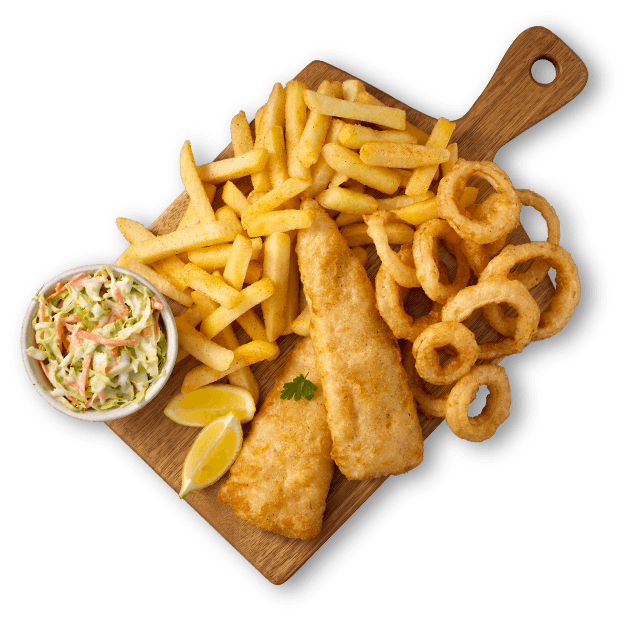 Hake fillets with chips and onion rings on a wooden board with coleslaw
