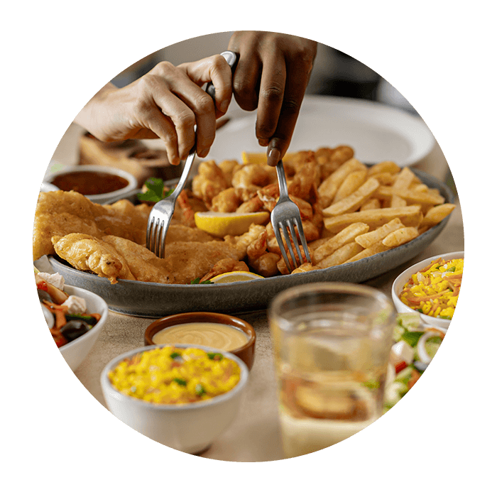 Fish and seafood sharing platter with rice and salad